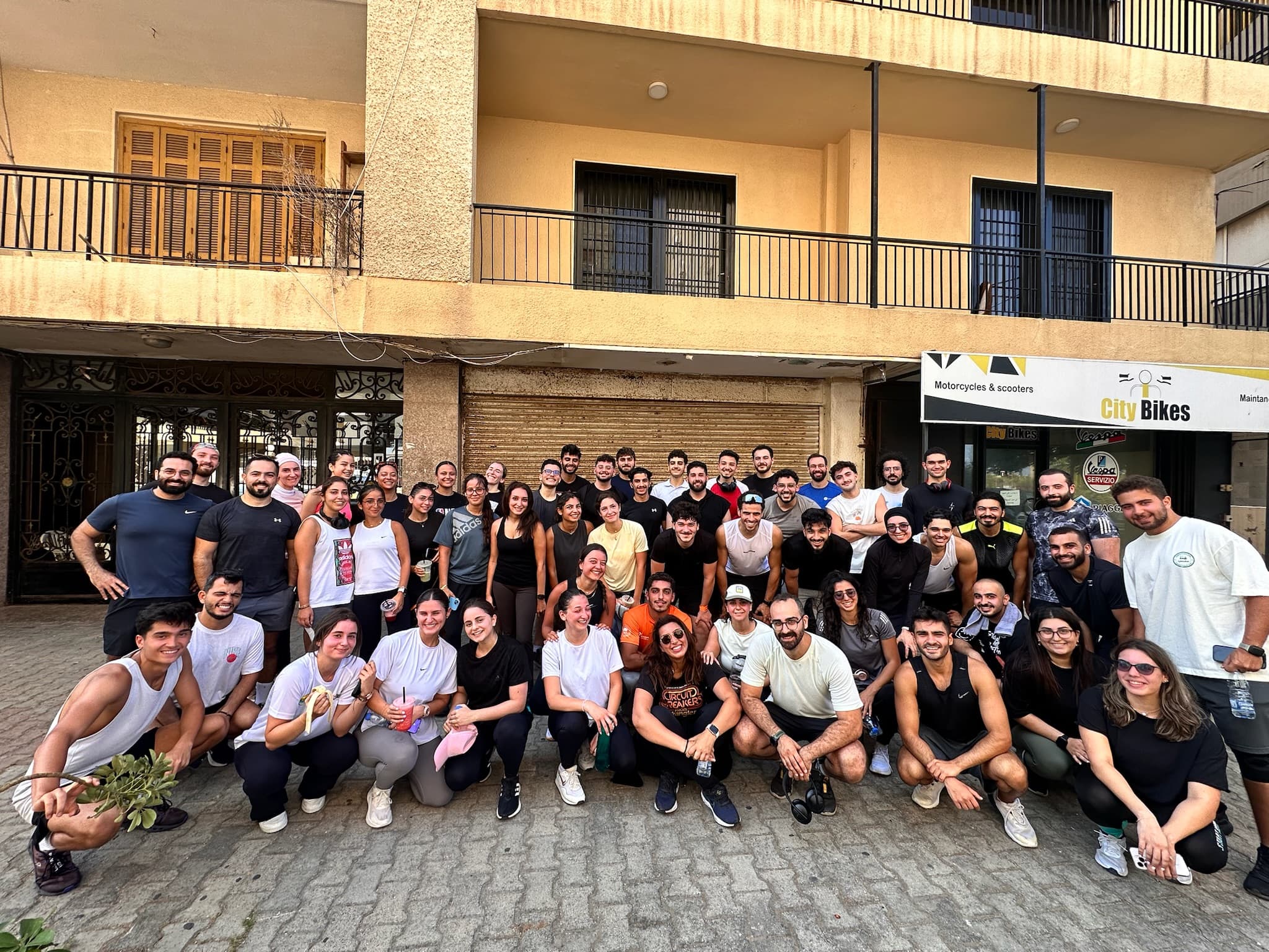 Large group photo after a run in Tripoli city streets